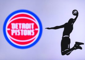 Detroit Pistons Logo mit Schattenfigur die einen Slamdunk ausführt