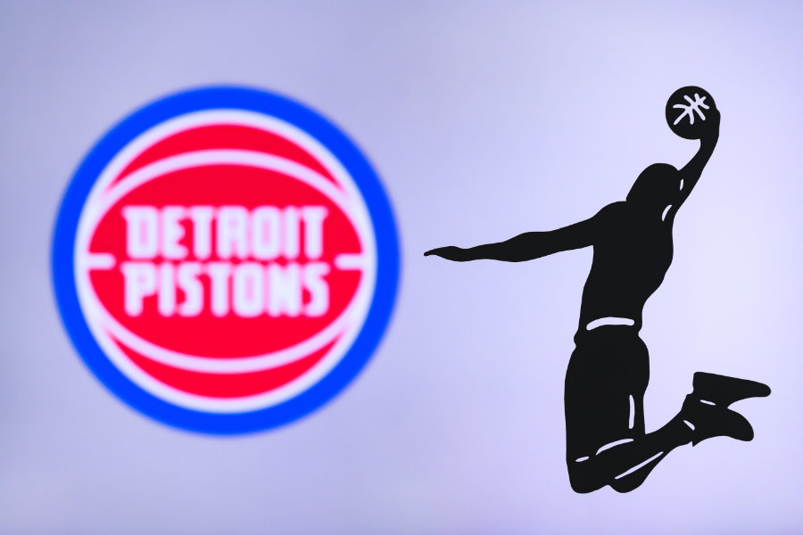 Detroit Pistons Logo mit Schattenfigur die einen Slamdunk ausführt